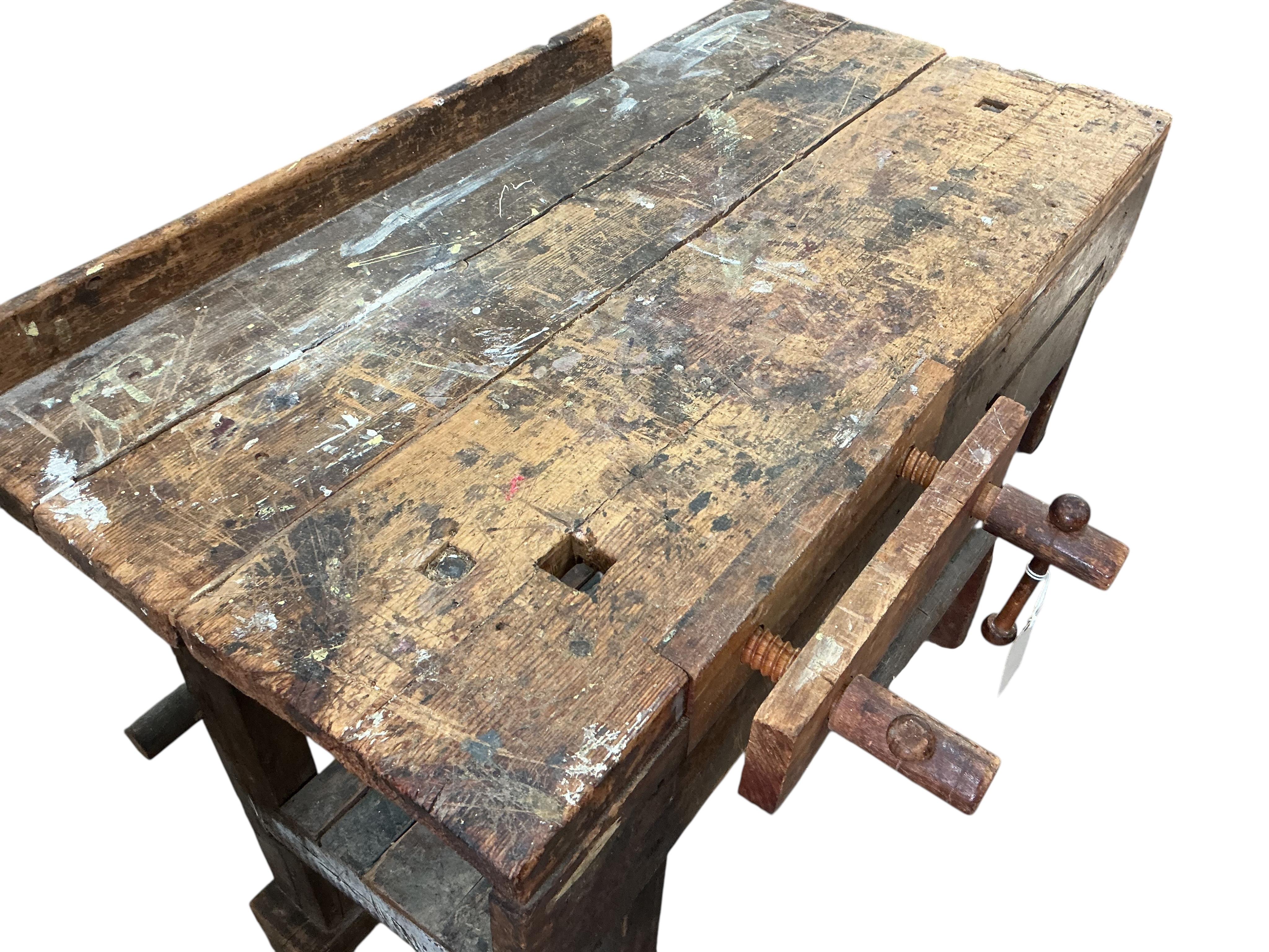 A small Provincial pine work bench with vice, width 92cm, depth 46cm, height 77cm